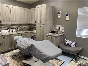 Clean, professional medical spa treatment room with neutral tones at Chatty Shack Salon & Med Spa in Casa Grande